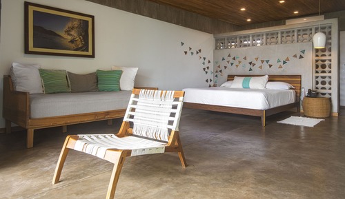 King Deluxe Room, 1 King Bed with Sofa bed, view of a lush and vibrant tropical garden.