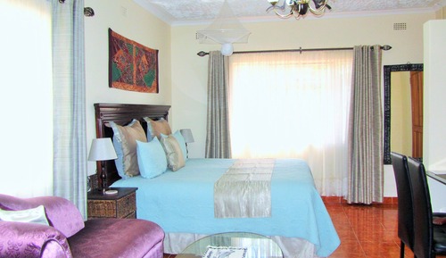 Suite, 1 cama de matrimonio grande, vistas al jardín