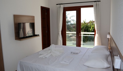 Habitación de lujo con 2 camas individuales, 1 cama de matrimonio grande, frente a la playa