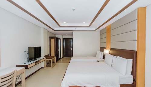 Habitación superior con 2 camas individuales, balcón
