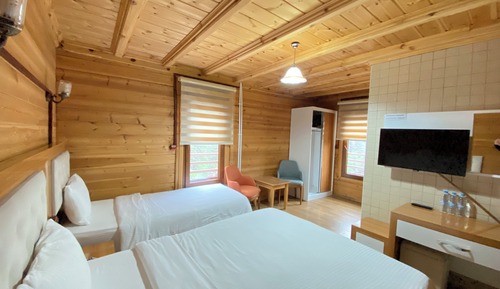 Habitación triple, varias camas