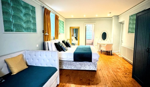 Habitación cuádruple Deluxe, varias camas