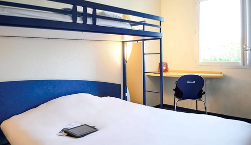 Habitación triple, varias camas