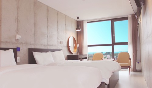 Habitación triple Deluxe, varias camas