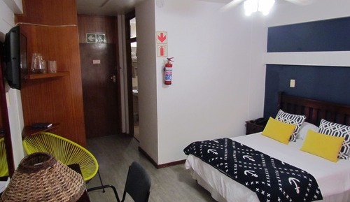 Habitación triple, varias camas