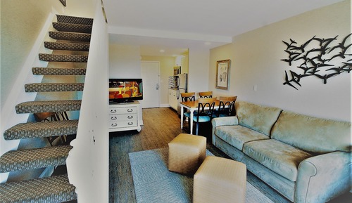 Suite ejecutiva, varias camas, cocina básica, vistas al mar