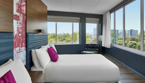Ultra Savvy Suite, 2 Queen Beds, Sofabed, Living area