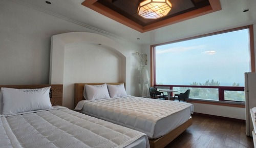 Habitación con 2 camas individuales, vistas al mar