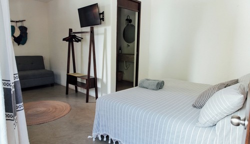 Habitación triple Deluxe, patio, vistas al jardín