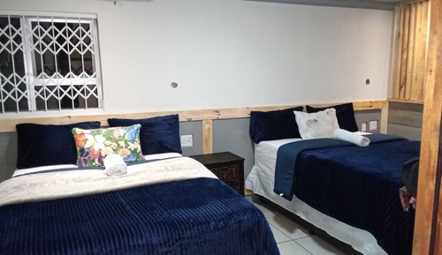Habitación Deluxe con 2 camas individuales, vistas al jardín