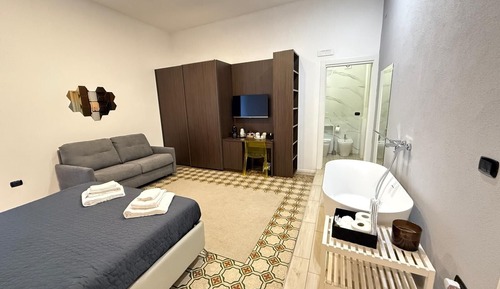 Habitación cuádruple Deluxe, balcón, vistas a la ciudad
