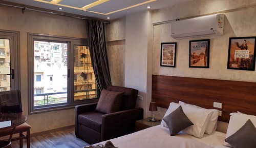 Habitación superior con 1 cama doble o 2 individuales, vistas a la ciudad
