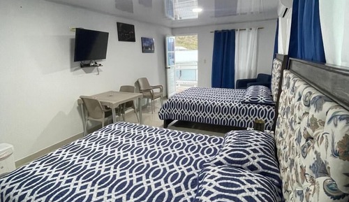 Habitación cuádruple superior, 2 camas dobles, vistas al mar
