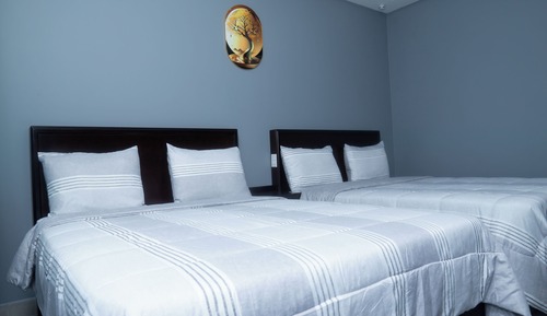 Suite exclusiva, varias camas, cocina básica, vistas al patio