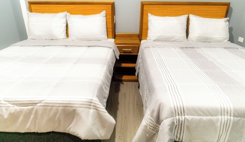 Suite Deluxe, varias camas, cocina básica, vistas a la ciudad