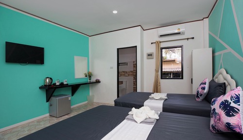 Habitación triple familiar, vistas al jardín
