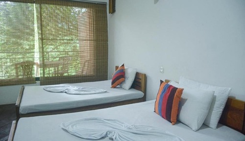 Habitación cuádruple Confort, vistas al jardín
