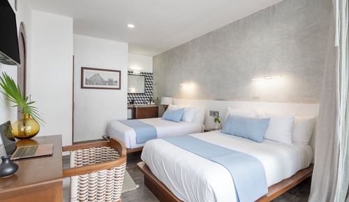 Suite de lujo, 2 camas dobles, baño privado, vistas al mar