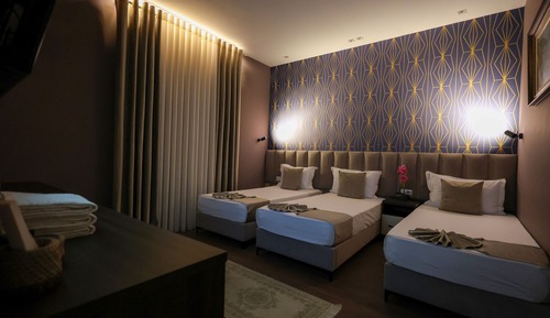 Habitación triple Deluxe, vistas al jardín