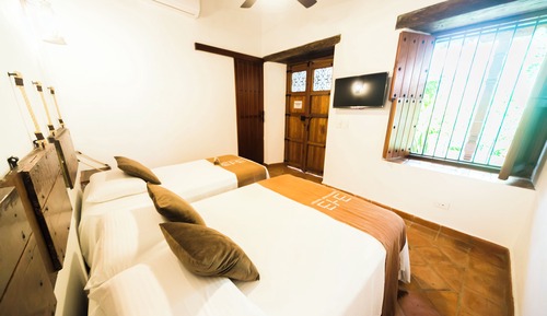 Habitación triple Confort, vistas al jardín