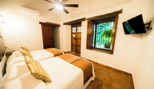 Habitación cuádruple familiar, vistas al jardín