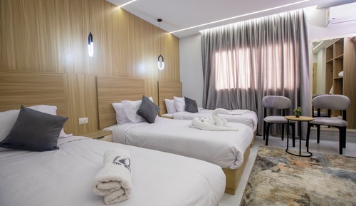 Habitación triple de lujo, varias camas