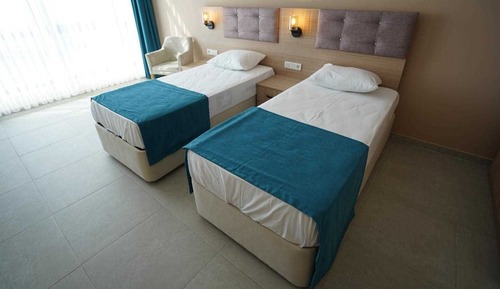 Habitación triple Deluxe, varias camas