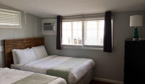 Suite Deluxe, varias camas, cocina, vistas a la ciudad