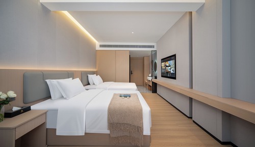 Habitación superior con 2 camas individuales, vistas a la ciudad