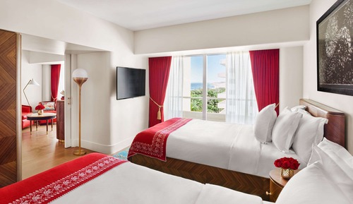 Suite junior, 2 camas de matrimonio, vistas parciales al mar
