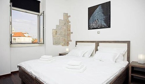 Habitación superior con 2 camas individuales, vistas a la ciudad