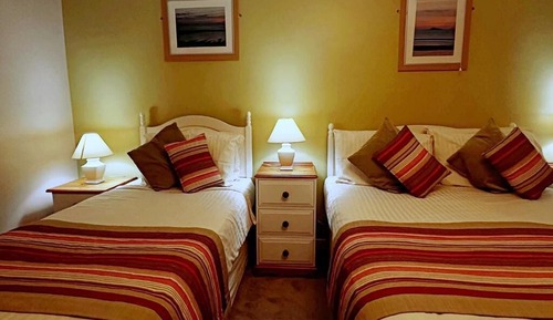 Habitación triple, vistas al mar