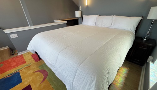 Habitación triple Deluxe, varias camas, frigorífico, vistas al canal