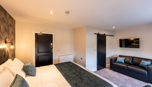 Habitación cuádruple Deluxe, varias camas