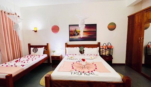Habitación triple Deluxe, balcón, vistas al jardín