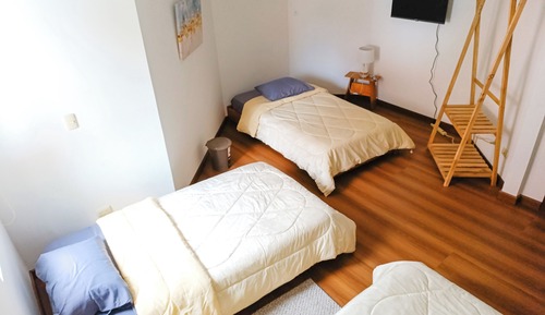 Habitación triple Confort, vistas al jardín