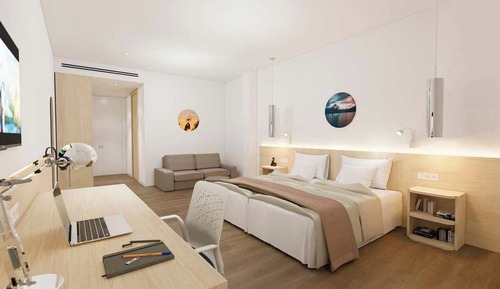 Habitación superior con 2 camas individuales, vistas al jardín