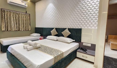 Habitación triple Premium, varias camas