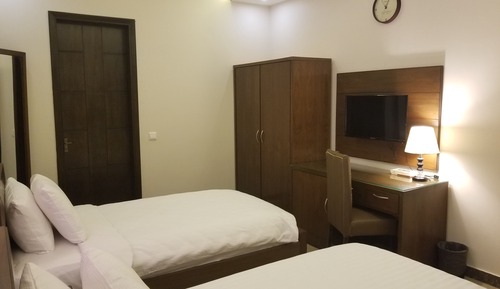 Habitación Business, varias camas, baño privado