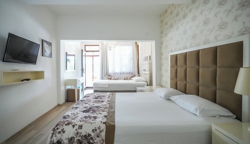 Habitación triple, vistas al mar