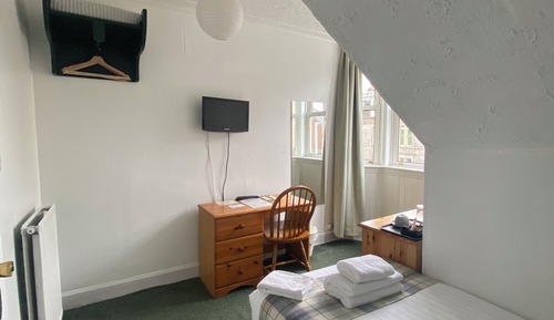 Basic Single Room with Shared Bathroom