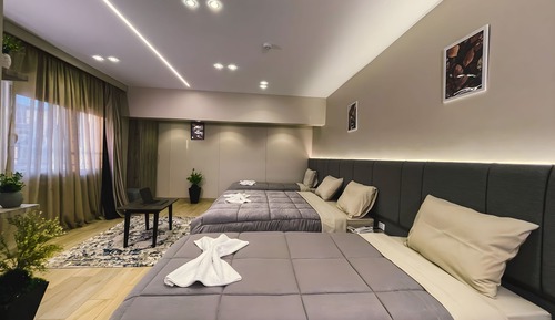 Habitación cuádruple Deluxe, varias camas
