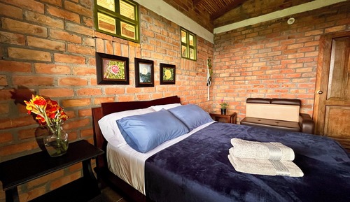 Habitación superior, 1 cama doble, vistas al jardín