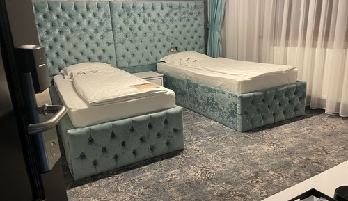 Habitación Elite con 1 cama doble o 2 individuales