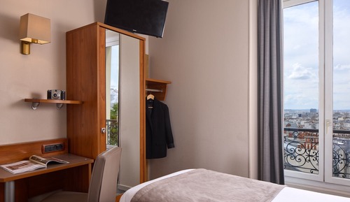 Habitación superior con 2 camas individuales, vistas a la ciudad