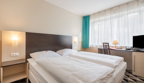 Habitación Confort con 1 cama doble o 2 individuales