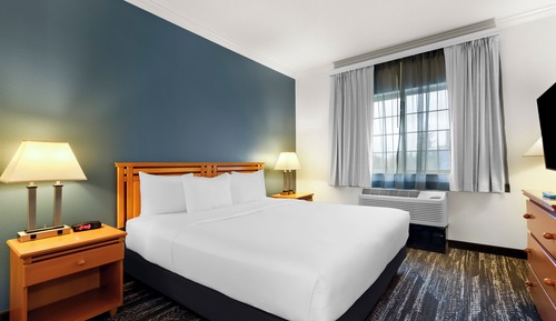 Suite, 1 King bed with Sofa Bed, Refrigerator & Microwave