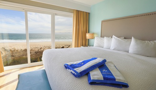 Suite Deluxe, 1 cama de matrimonio grande, frente al mar (Corner Balcony)
