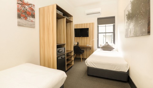 Twin room with shared bathroom