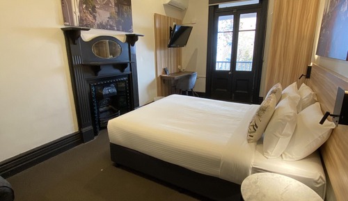 Queen Balcony room with shared bathroom